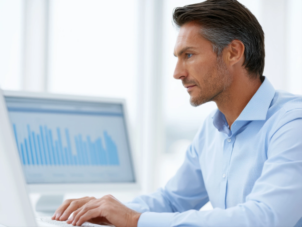 Fractional CFO in Arizona Financial professional reviewing charts on a computer monitor at a desk
