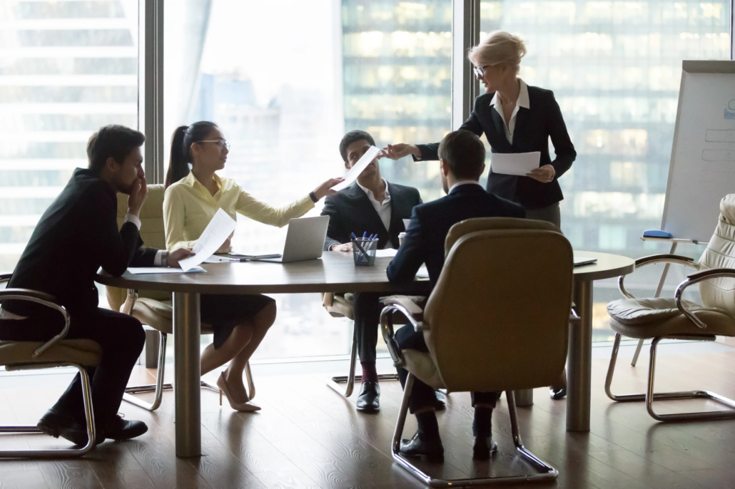 Fractional CFO in Massachusetts Team of colleagues working together around a table in an office