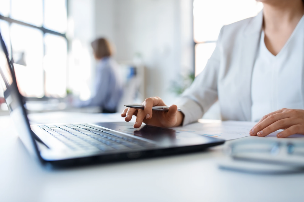 Fractional CFO in New York Small business owner working on a laptop at an office desk