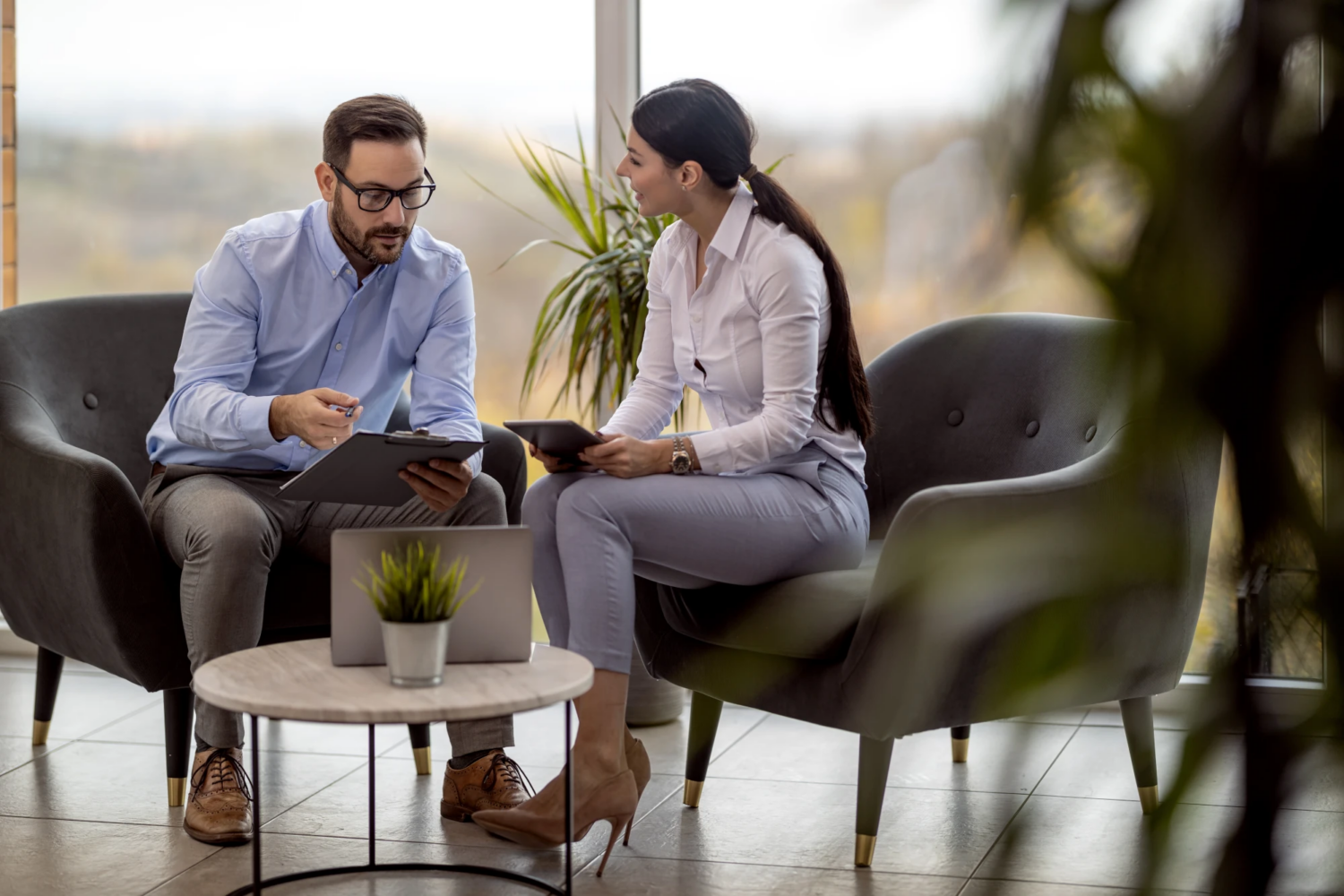 Internal finance leader and outsourced CFO collaborating in a meeting