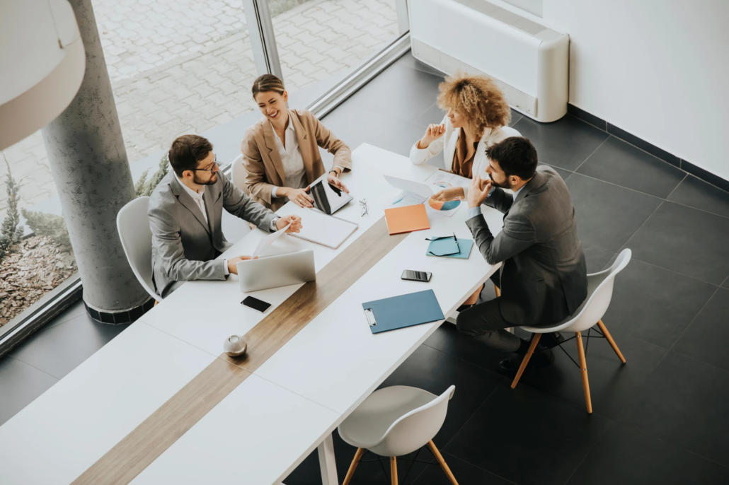 Fractional CFO in Atlanta Team of four collaborating around a table in an office