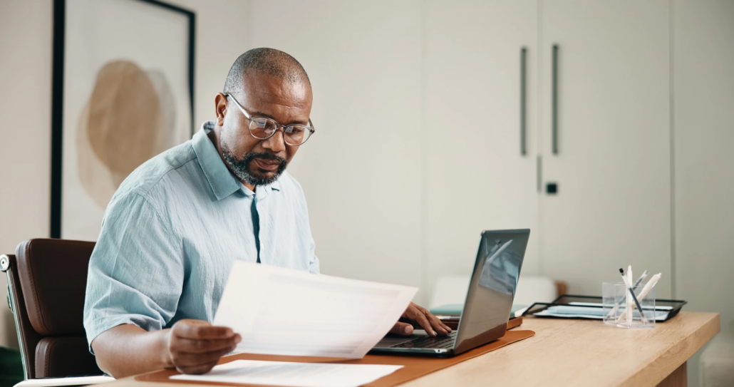 Outsourced CFO and Fractional CFO in Kansas Printed financial forecast and charts on a desk